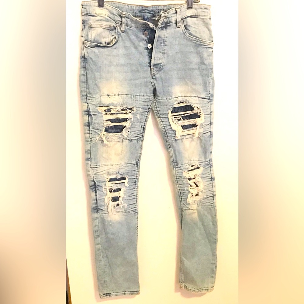 Mens jeans with ripps button fly..